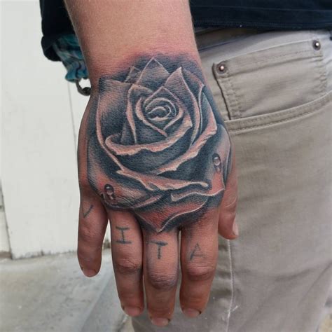 black rose tattoo on hand